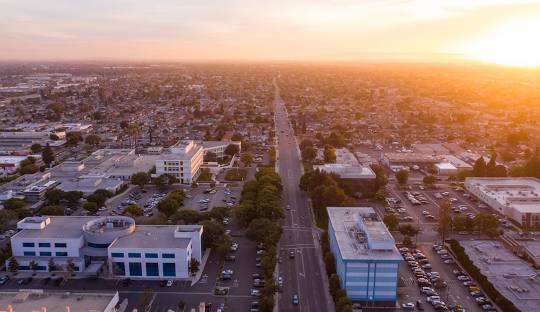 Personal Injury Trial Attorney Locations 15 Aerial view of cityscape at sunset.