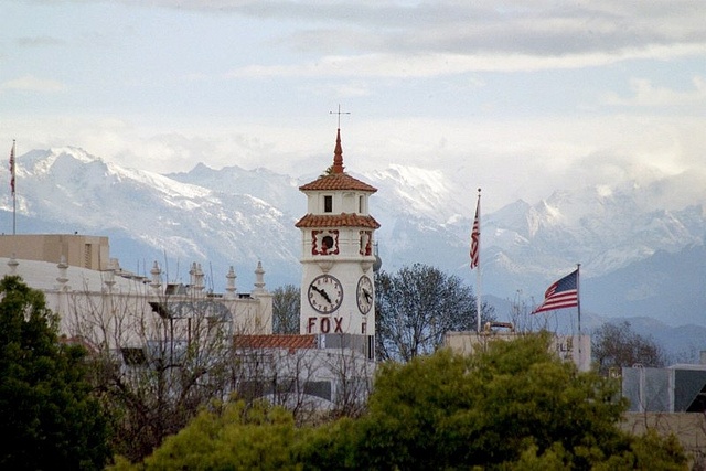 Personal Injury Trial Attorney Locations 51 Clock tower with mountains in the background.