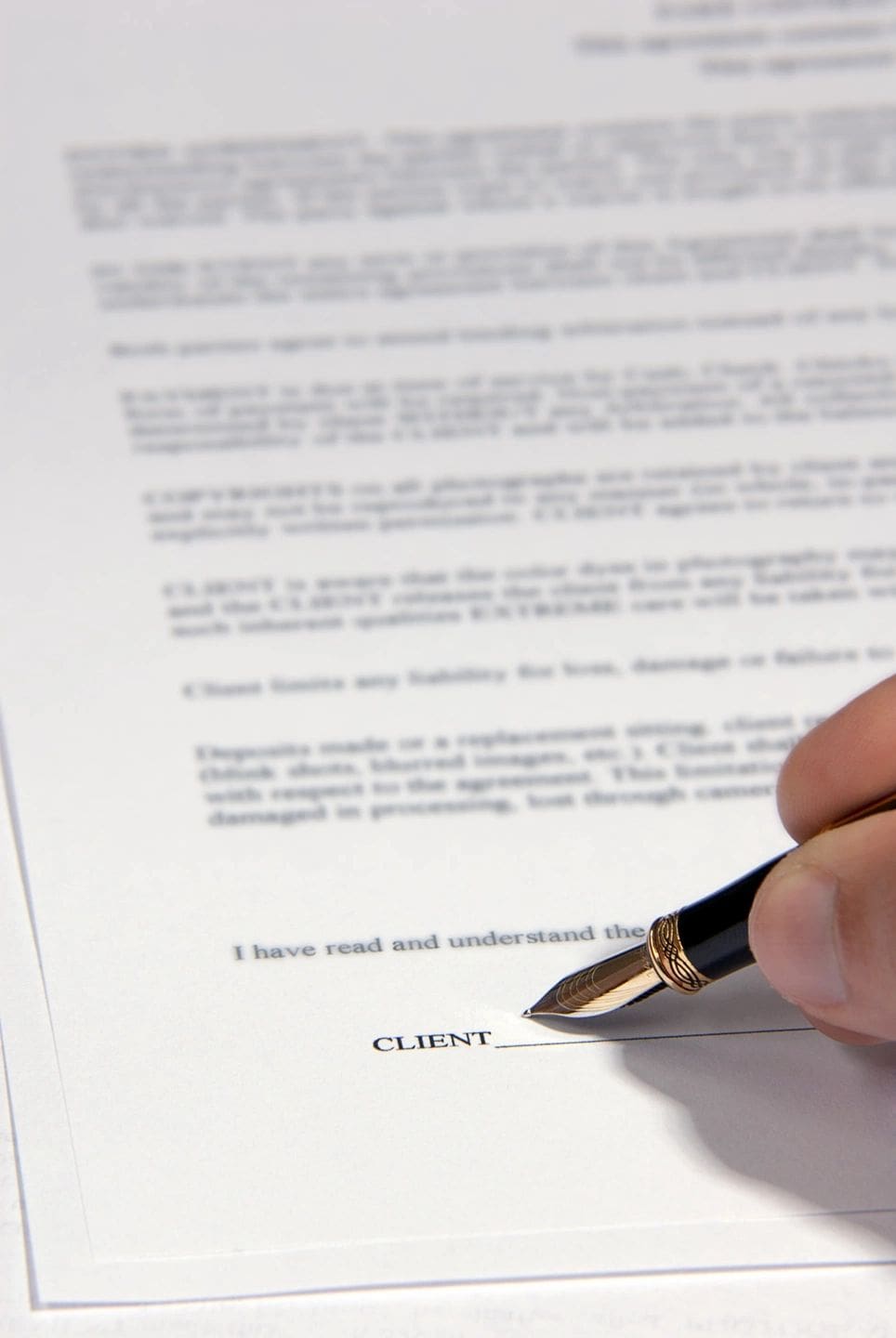 Signing a contract with a pen. Signing a contract with a pen.